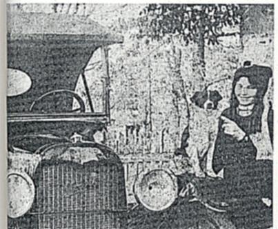 Ina Hovious, with her car and a little friend.